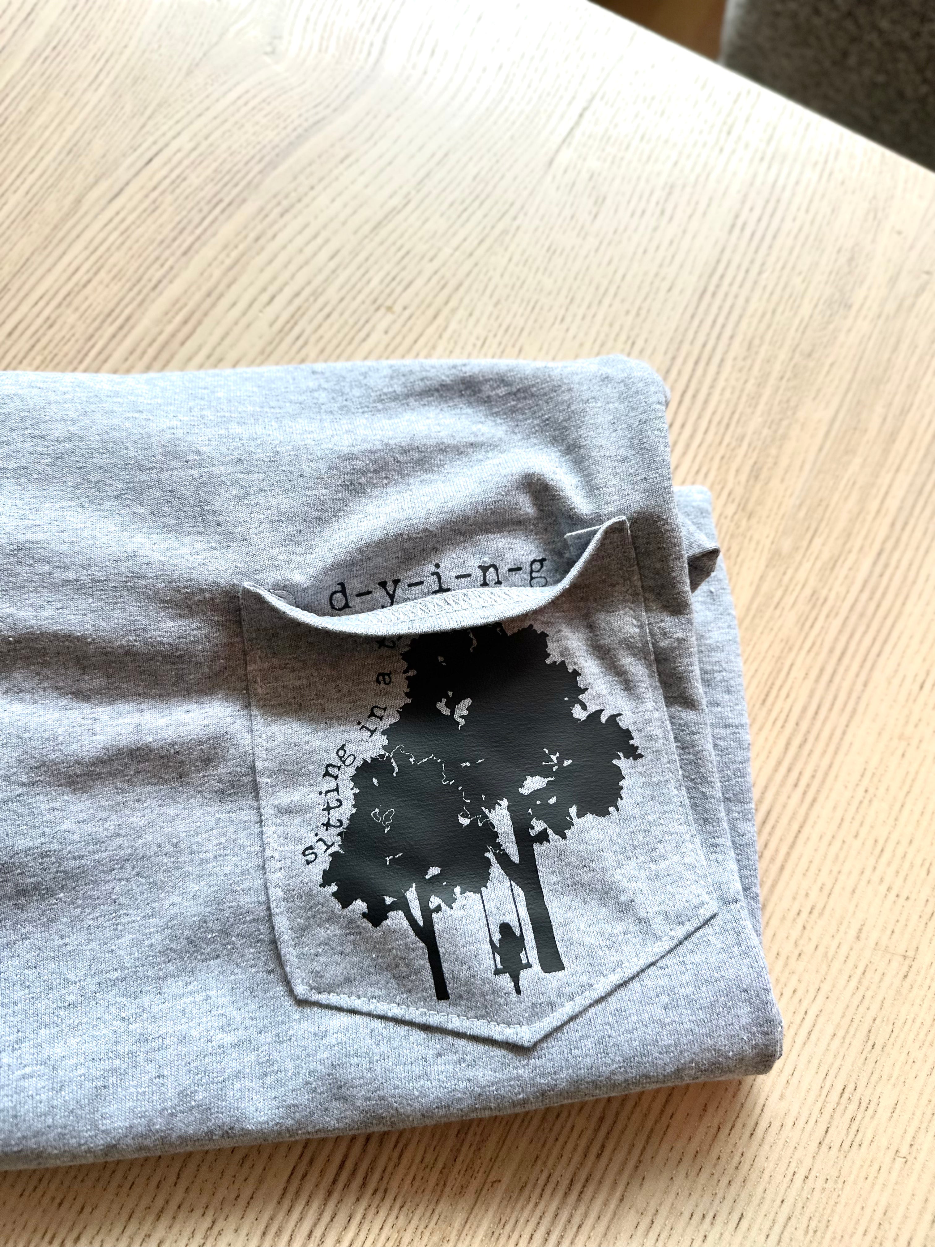 SITTING IN A TREE PEEP POCKET TEE